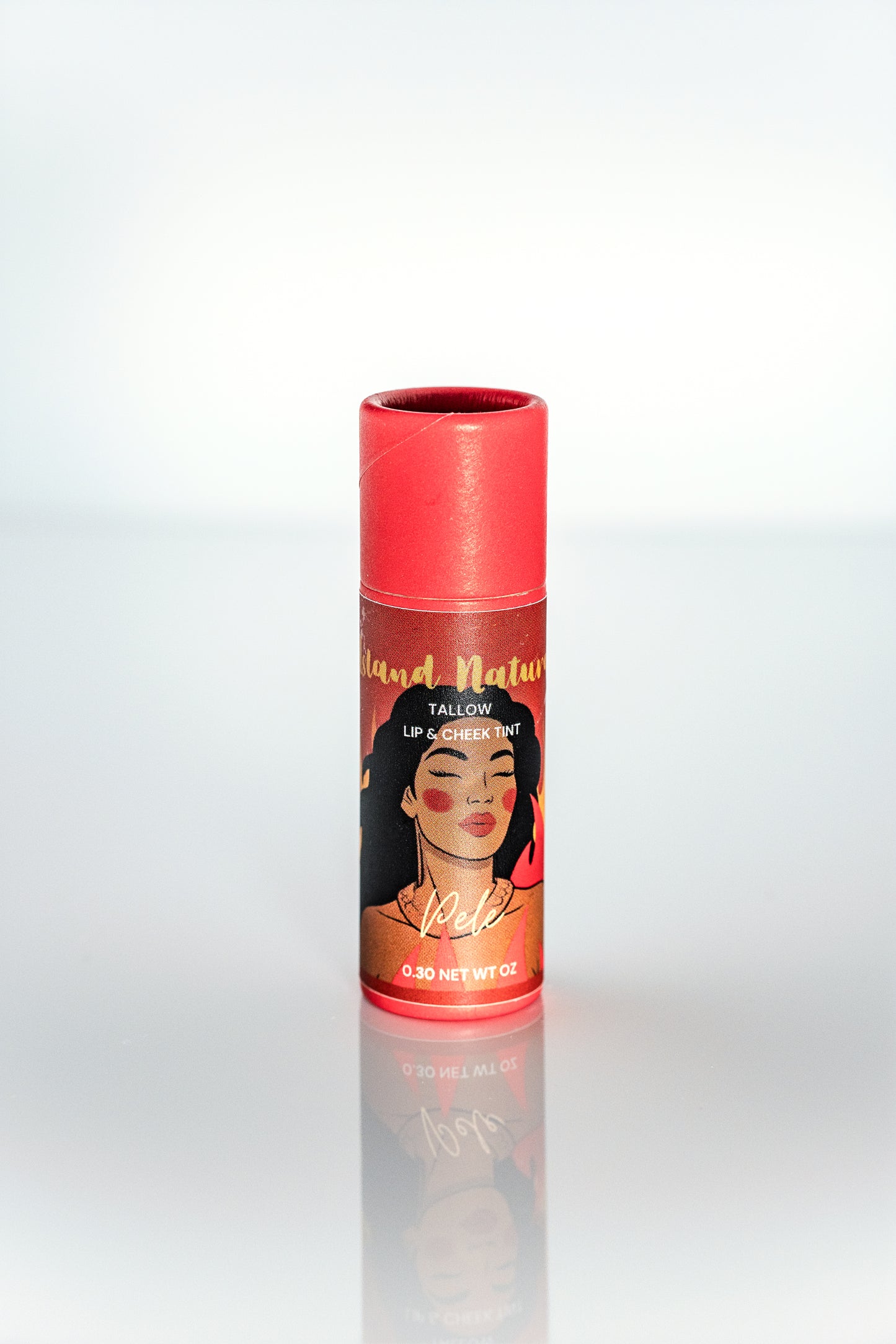 Pele tinted tallow lip balm tube with a colorful label featuring a woman's face on a white background made by Island Natural Skincare