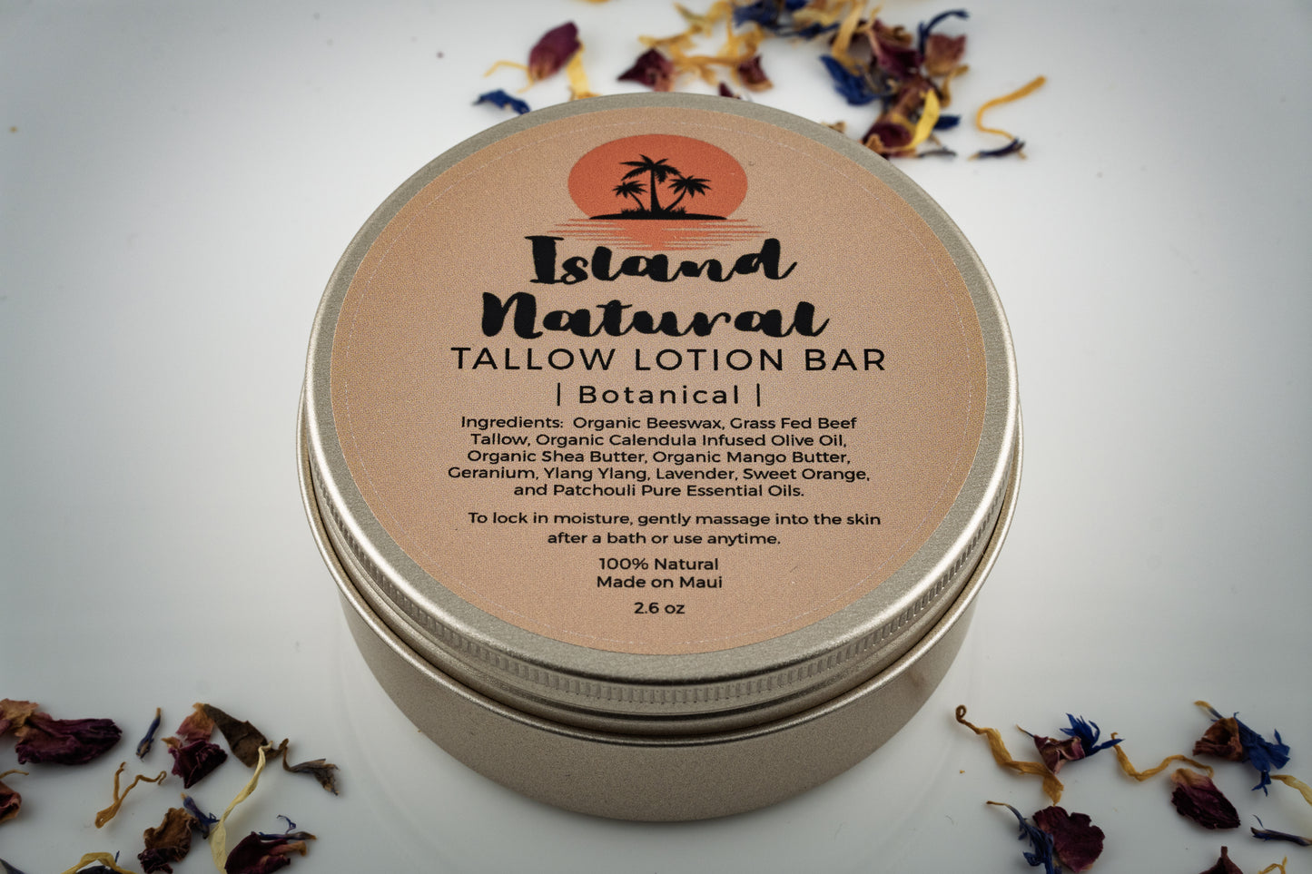 Island Natural Skincare Tallow Lotion Bar packaging with dried botanicals on a light background