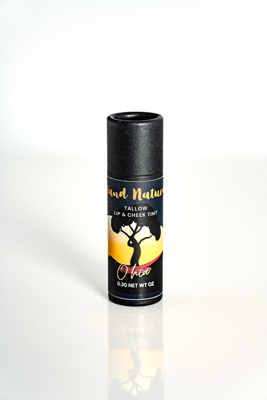 'Ohi'a tinted tallow lip balm with black lid and colorful label on a white background by Island Natural Skincare